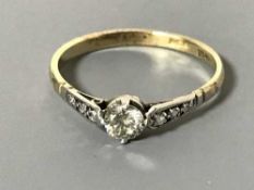 18ct gold solitaire diamond with diamonds to the shoulders - approximately .