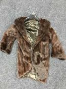 A lady's three quarter length squirrel fur jacket