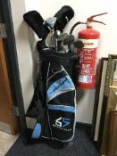 A Dunlop golf bag containing a part set of Dunlop golf clubs