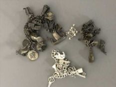 Three silver charm bracelets (3)