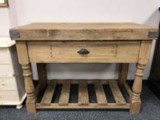 A reclaimed pine butchers block fitted a drawer