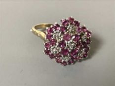 A 9ct gold ruby and diamond cluster ring,