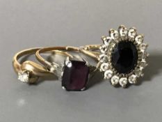 Three gold rings, 1 set with diamond .