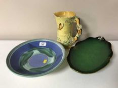 A circular Poole pottery shallow bowl depicting fish together with a green Carltonware Verte Royale