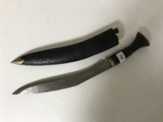 A kukri knife in sheathe
