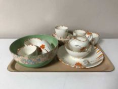 A tray containing a twenty-one piece hand painted Myott tea service No.