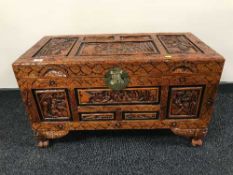 A carved camphor wood chest