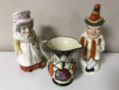 Two large pottery Punch and Judy toby jugs together with a 20th century hand-painted pottery jug