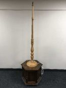 A hexagonal storage table and a pine standard lamp