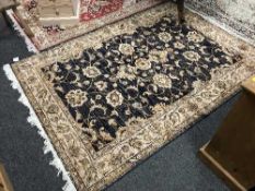 A fringed Persian Ziegler rug on blue ground,