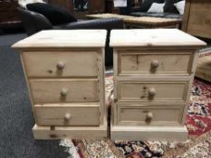 A pair of three drawer pine chests