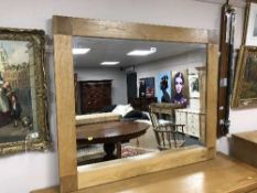 A light oak overmantel mirror