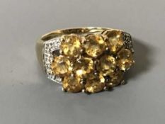 A 9ct gold citrine and diamond ring,