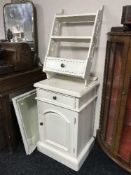 A painted beside cabinet fitted a drawer,