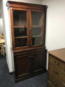 A late 19th century mahogany glazed door bookcase