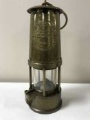 A brass Eccles Protector lamp type 6