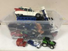 A box of assorted die cast vehicles and model cars