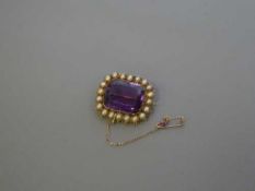 A gold mounted Victorian pearl and amethyst brooch