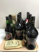 A tray of twelve bottles of alcohol including sherry, Baileys,