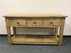 A reclaimed pine dresser base fitted with three drawers