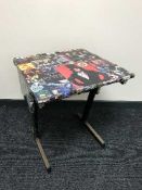 A mid-20th century school desk (80's rock bands)
