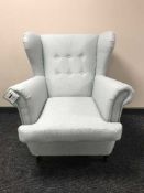 A wing back armchair