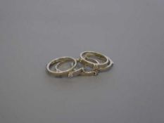 18ct white gold puzzle ring 9 diamonds 8.