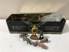 A tin of vintage lead figures of farmyard animals,