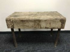 An antique oak drop leaf table