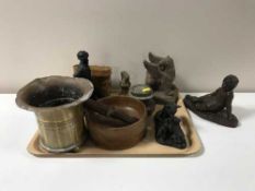 A tray containing an ammunition shell planter, Eastern knife in sheath, resin figures,