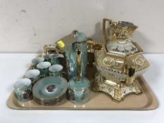 An early 20th century five piece English Pottery tea service and a Japanese lustre coffee set