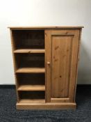 A pine child's wardrobe fitted with shelves