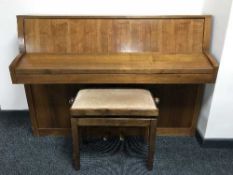 A teak-cased Baldwin over-strung piano, together with an adjustable piano stool.