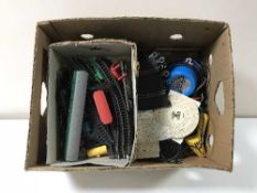 A box containing Scalectrix, assorted Triang rolling stock and track,