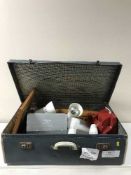 A mid-20th century luggage case containing light fittings, Bakelite telephone, backgammon set,