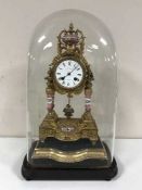 A French gilt-metal and porcelain eight-day mantel clock under glass dome,