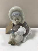 A Lladro figure - Eskimo with polar cub