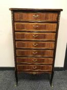 A continental seven drawer gilt metal mounted chest