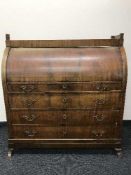 A 19th century mahogany barrel fronted bureau