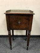 A Victorian mahogany pot cupboard with galleried top