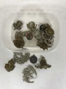 A box of military cap badges