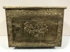 A brass embossed coal box