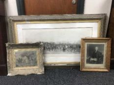 A large gilt-framed print entitled 