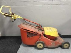 An Abac air compressor and a Wolf electric lawn mower