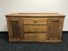 An antique pine sideboard