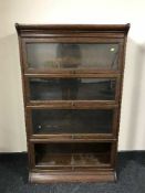 An oak Globe Wernicke style four tier stacking bookcase