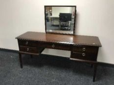 A Stag Minstrel kneehole dressing table and a bedside table (2)