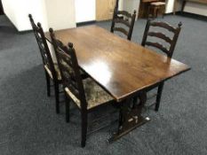 An oak refectory table and four ladder back chairs