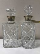 Two lead crystal decanters with silver collars