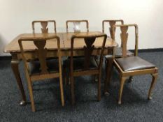 A walnut eight piece dining room suite